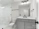 Contemporary bathroom with a glass shower, gray vanity, and a large mirror at 925 Twin Lakes Rd, Rock Hill, SC 29732
