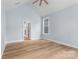 Airy bedroom with vaulted ceiling, light hardwood floors, and a view into the home's hallway at 925 Twin Lakes Rd, Rock Hill, SC 29732