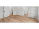 Bright, open bedroom with light wood floors and a view of the outdoors through a large window at 925 Twin Lakes Rd, Rock Hill, SC 29732