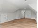 Spacious bonus room with light wood flooring and multiple closets and entry doors at 925 Twin Lakes Rd, Rock Hill, SC 29732