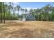 Exterior view of home with long driveway and large backyard at 925 Twin Lakes Rd, Rock Hill, SC 29732