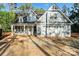 New home construction with light blue siding, white trim, two car garage and covered front porch at 925 Twin Lakes Rd, Rock Hill, SC 29732