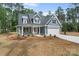 Beautiful two-story home with a lush front lawn, two-car garage, and inviting entrance, showcasing charm and curb appeal at 925 Twin Lakes Rd, Rock Hill, SC 29732