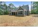 Rear exterior view of home with blue siding, a dark roof, and large windows at 925 Twin Lakes Rd, Rock Hill, SC 29732