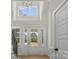 Elegant foyer features high ceilings, large windows, and a beautiful chandelier at 925 Twin Lakes Rd, Rock Hill, SC 29732