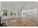 Bright open concept living space connecting the dining and living areas, all complemented by hardwood floors at 925 Twin Lakes Rd, Rock Hill, SC 29732
