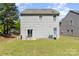 Spacious backyard with a patio and green lawn, perfect for outdoor enjoyment at 9527 Turning Wheel Dr, Charlotte, NC 28214
