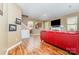 Inviting living room featuring hardwood floors, a fireplace and seamlessly connected spaces at 9527 Turning Wheel Dr, Charlotte, NC 28214
