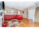 A cozy living room featuring hardwood floors, a fireplace, and ample natural light at 9527 Turning Wheel Dr, Charlotte, NC 28214