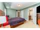 Bright, spacious bedroom with neutral carpet, and a door that leads to a bathroom at 9527 Turning Wheel Dr, Charlotte, NC 28214