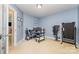 Spacious office with neutral carpet, a window that provides lots of sunlight, and a treadmill at 9527 Turning Wheel Dr, Charlotte, NC 28214