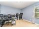 Spacious office with neutral carpet, a window that provides lots of sunlight, and a treadmill at 9527 Turning Wheel Dr, Charlotte, NC 28214