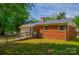 Rear view of home showing backyard featuring a ramp and brick facade at 105 Hopper St, Clover, SC 29710