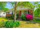 Inviting single-Gathering home with brick facade, blooming flowers, and a well-kept lawn at 105 Hopper St, Clover, SC 29710