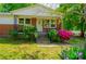 Quaint single-Gathering home with a brick facade, flowering bushes, and charming curb appeal at 105 Hopper St, Clover, SC 29710