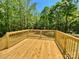 A spacious deck offers a great view of the wooded backyard at 109 Bee Tree Ln, Salisbury, NC 28144