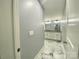 Modern bathroom with gray walls, marble floors, dual vanities, and stylish mirrors, designed for comfort and style at 109 Bee Tree Ln, Salisbury, NC 28144