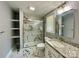 Modern bathroom featuring granite counters, sleek fixtures, and an elegant glass-enclosed shower with marble-like tiling at 109 Bee Tree Ln, Salisbury, NC 28144
