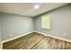 Bedroom featuring laminate floors and window at 109 Bee Tree Ln, Salisbury, NC 28144