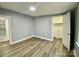 Bedroom featuring laminate floors and an ensuite bathroom at 109 Bee Tree Ln, Salisbury, NC 28144