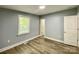 Bedroom featuring laminate floors and window at 109 Bee Tree Ln, Salisbury, NC 28144
