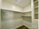 Well-organized walk-in closet with shelving and rod for efficient clothing storage and maximizing space at 109 Bee Tree Ln, Salisbury, NC 28144