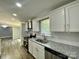 Modern kitchen with gray cabinets, granite countertops, stainless steel appliances, and ample counter space for cooking at 109 Bee Tree Ln, Salisbury, NC 28144