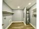 Spacious laundry room with ample shelving and modern water heater at 109 Bee Tree Ln, Salisbury, NC 28144