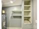 A utility room with built-in shelving, and a hot water tank for efficient storage and functionality at 109 Bee Tree Ln, Salisbury, NC 28144