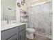 Well-maintained bathroom with a shower, a toilet and vanity with a mirror at 11010 Redcoat Hill Ln # 33, Huntersville, NC 28078