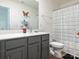 Bathroom featuring gray vanity, white quartz countertop, a large mirror, and a shower at 11010 Redcoat Hill Ln # 33, Huntersville, NC 28078