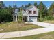 Charming two-story home with a well-manicured lawn and inviting curb appeal at 11010 Redcoat Hill Ln # 33, Huntersville, NC 28078