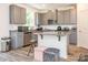 Contemporary kitchen featuring gray cabinetry, granite counters, and a center island at 11010 Redcoat Hill Ln # 33, Huntersville, NC 28078