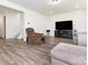 Spacious living room with modern flooring and a cozy, comfortable seating area at 11010 Redcoat Hill Ln # 33, Huntersville, NC 28078