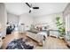 Inviting bedroom featuring a ceiling fan, wood floors, and large windows for ample natural light at 1115 Greenleaf Ave # B, Charlotte, NC 28202