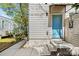Stylish front door entrance with blue door, modern lighting and hardscape at 1115 Greenleaf Ave # B, Charlotte, NC 28202