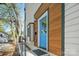 Charming front entry featuring a bright blue door and natural wood accents at 1115 Greenleaf Ave # B, Charlotte, NC 28202
