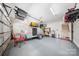 Spacious garage featuring ample storage, with a trailer and other belongings at 1115 Greenleaf Ave # B, Charlotte, NC 28202