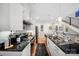 Well-equipped kitchen featuring white cabinetry, a dark countertop island, and stainless steel appliances at 1115 Greenleaf Ave # B, Charlotte, NC 28202