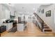 Contemporary kitchen with a center island, stainless steel appliances, and access to the living area at 1115 Greenleaf Ave # B, Charlotte, NC 28202