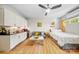 Comfortable living space featuring a cozy bed, modern sofa, and small kitchen area at 1115 Greenleaf Ave # B, Charlotte, NC 28202