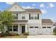 Well-maintained two-story home boasts a two-car garage and a welcoming front porch at 1218 Juddson Dr, Waxhaw, NC 28173