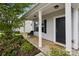 Inviting front porch with seating and a 'HOME' doormat, creating a cozy entrance at 1218 Juddson Dr, Waxhaw, NC 28173