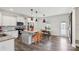 Bright open kitchen with an island, stainless steel appliances, and modern finishes with dining area at 1218 Juddson Dr, Waxhaw, NC 28173