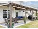 Stylish outdoor patio with dining, lounge, and bar areas, perfect for gatherings and relaxation at 1218 Juddson Dr, Waxhaw, NC 28173