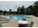 Community pool with lounge seating and lush surrounding greenery offers a relaxing outdoor amenity at 1218 Juddson Dr, Waxhaw, NC 28173