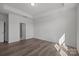 Comfortable bedroom with a tray ceiling, wood floors and neutral tones, creating a relaxing retreat at 124 Canary Ln # 7, Mooresville, NC 28115