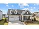 Charming home with a two-car garage, neat landscaping, and a welcoming entrance for an inviting curb appeal at 124 Canary Ln # 7, Mooresville, NC 28115