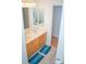 Bathroom featuring a double sink vanity with oak cabinets and tile floors at 13316 Alex Mill Dr, Pineville, NC 28134