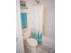 Bathroom featuring a shower-tub combo and a toilet with neutral tile and decor at 13316 Alex Mill Dr, Pineville, NC 28134